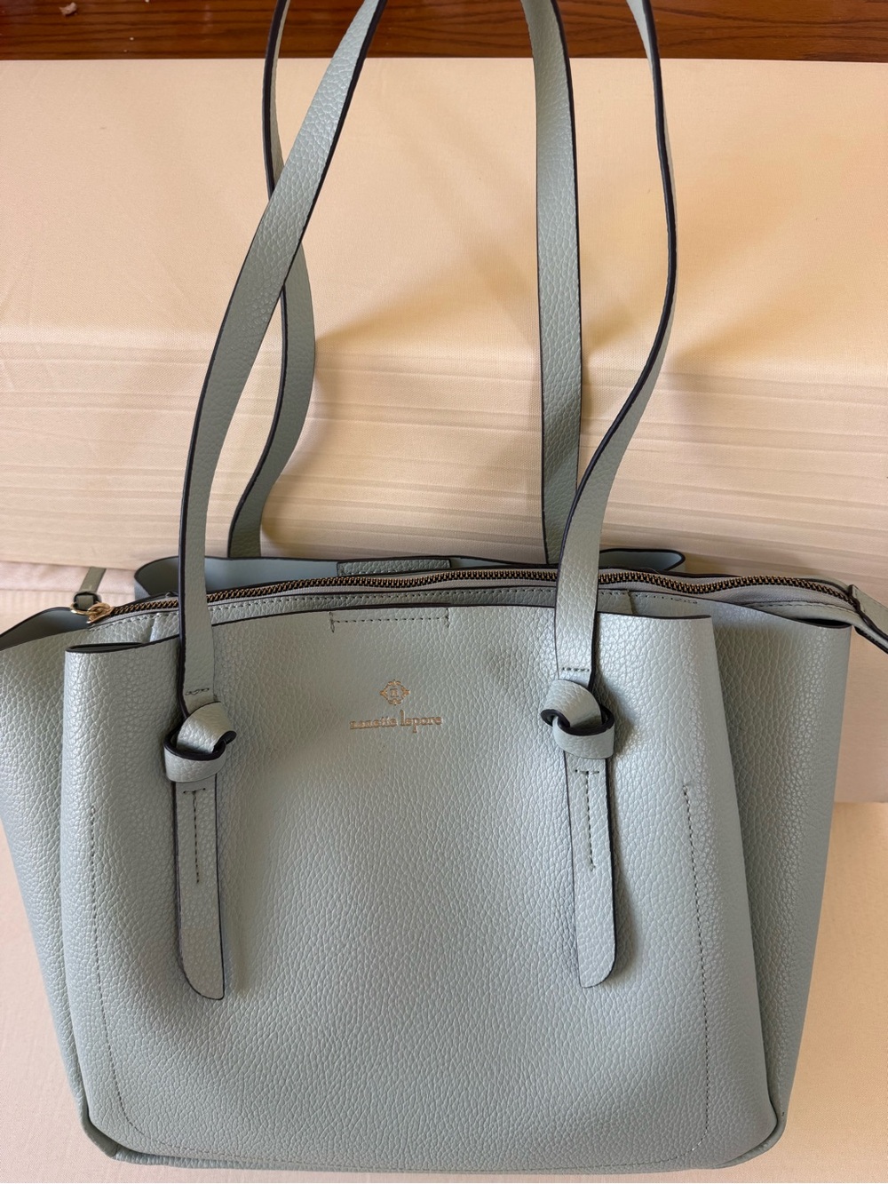 Nanette Lepore pale blue leather tote with gold logo